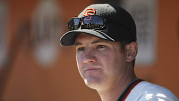 September 20, 2012; San Francisco, CA, USA; San Francisco Giants first baseman Brett Pill (6) in the dugout against the Colorado Rockies during the fourth inning at AT&T Park. 