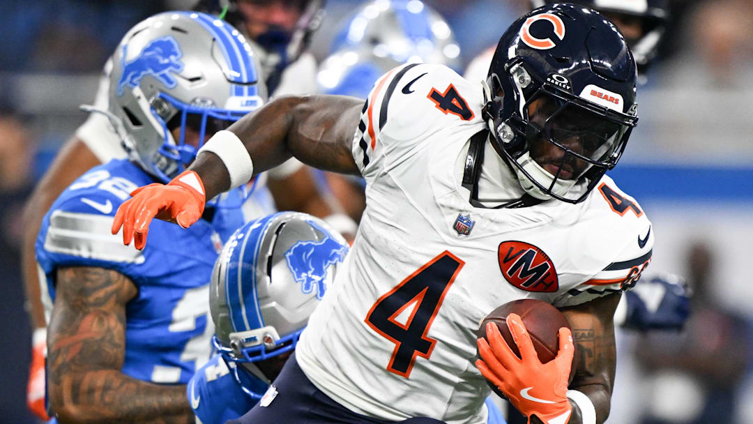 Chicago Bears running back D'Andre Swift (4) carries the ball against the Detroit Lions during the first quarter of the game at Ford Field.