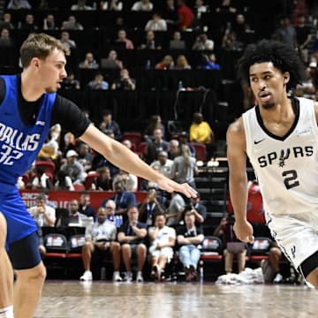 Jul 12, 2025; Las Vegas, NV, USA; Dallas Mavericks forward Cooper Flagg (32) defends against San Antonio Spurs guard Dylan Harper (2) in the second quarter of their game at Thomas & Mack Center. Mandatory Credit: Candice Ward-Imagn Images