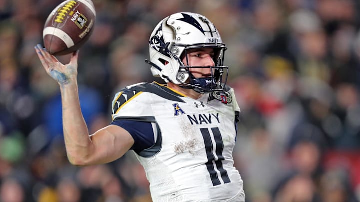 Dec 14, 2024; Landover, Maryland, USA; Navy Midshipmen quarterback Blake Horvath (11) celebrates his touchdown against the Army Black Knights during the second half of the the 125th Army-Navy game at Northwest Stadium. Mandatory Credit: Danny Wild-Imagn Images