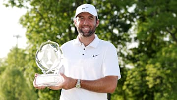 Scottie Scheffler poses with the winner's trophy following his victory at the 2025 Memorial Tournament at Muirfield Village
