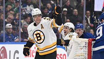 Nov 8, 2025; Toronto, Ontario, CAN;  Boston Bruins forward David Pastrnak (88) celebrates with forward Marat Khusnutdinov (92)after scoring a goal against the Toronto Maple Leafs in the second period at Scotiabank Arena. Mandatory Credit: Dan Hamilton-Imagn Images