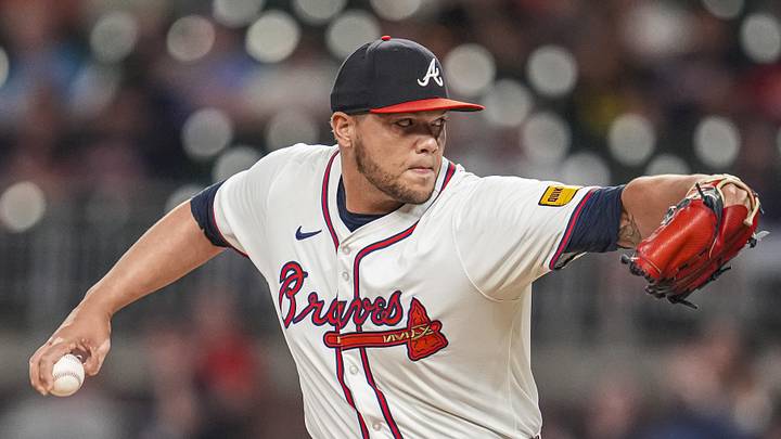 Sep 4, 2024; Cumberland, Georgia, USA; Atlanta Braves pitcher Joe Jimenez (77) pitches against the Colorado Rockies during the eighth inning at Truist Park. Mandatory Credit: Dale Zanine-Imagn Images