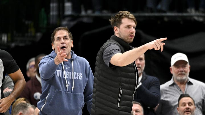 Dallas Mavericks guard Luka Doncic (right) and Mark Cuban (left) argue a call during the second half of the game against the New Orleans Pelicans at the American Airlines Center.