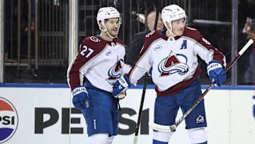Jan 26, 2025; New York, New York, USA;  Colorado Avalanche defenseman Cale Makar (8) celebrates with left wing Jonathan Drouin (27) after scoring a goal in the first period against the New York Rangers at Madison Square Garden. Mandatory Credit: Wendell Cruz-Imagn Images