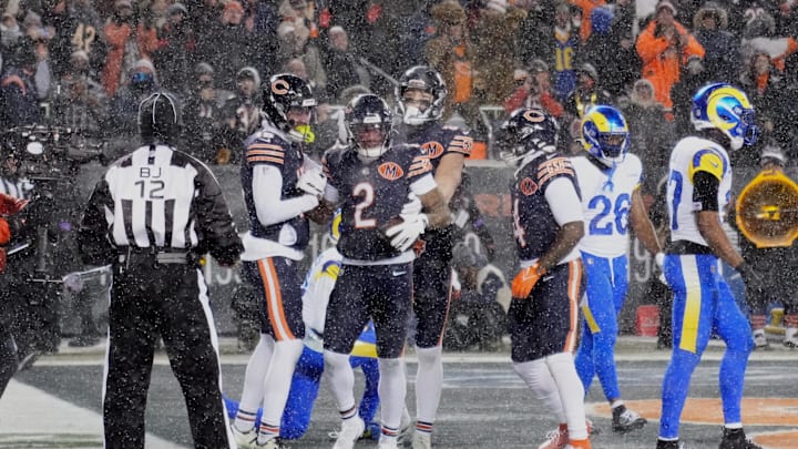 Jan 18, 2026; Chicago, IL, USA; Chicago Bears wide receiver DJ Moore (2) celebrates with teammates in the end zone after catching a touchdown pass against the Los Angeles Rams during the second quarter of an NFC Divisional Round game at Soldier Field. Mandatory Credit: David Banks-Imagn Images