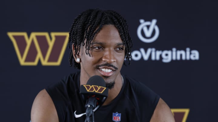 Jul 26, 2024; Ashburn, VA, USA; Washington Commanders quarterback Jayden Daniels speaks with the media after morning practice on day three of training camp at Commanders Park. Mandatory Credit: Geoff Burke-USA TODAY Sports