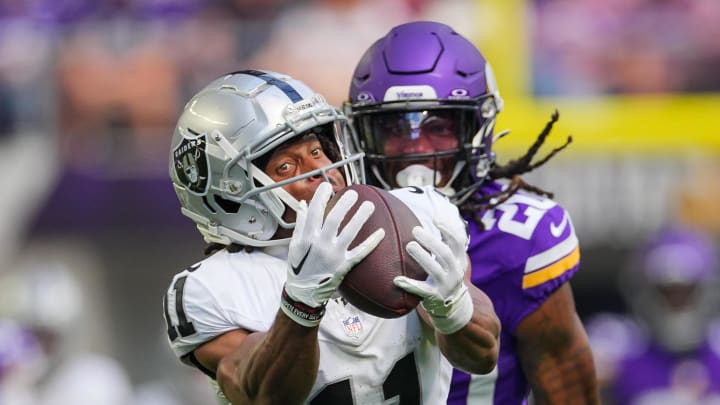 Aug 10, 2024; Minneapolis, Minnesota, USA; Las Vegas Raiders wide receiver Tre Tucker (11) catches a pass against the Minnesota Vikings in the second quarter at U.S. Bank Stadium. Mandatory Credit: Brad Rempel-USA TODAY Sports