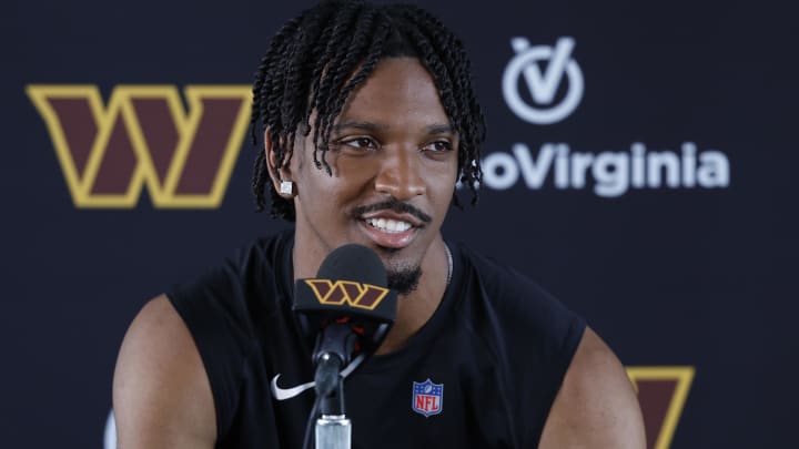 Jul 26, 2024; Ashburn, VA, USA; Washington Commanders quarterback Jayden Daniels speaks with the media after morning practice on day three of training camp at Commanders Park. Mandatory Credit: Geoff Burke-USA TODAY Sports