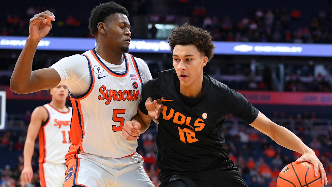 Dec 2, 2025; Syracuse, New York, USA; Tennessee Volunteers forward Nate Ament (10) drives against Syracuse Orange forward Tyler Betsey (5) during the first half at the JMA Wireless Dome. Mandatory Credit: Rich Barnes-Imagn Images
