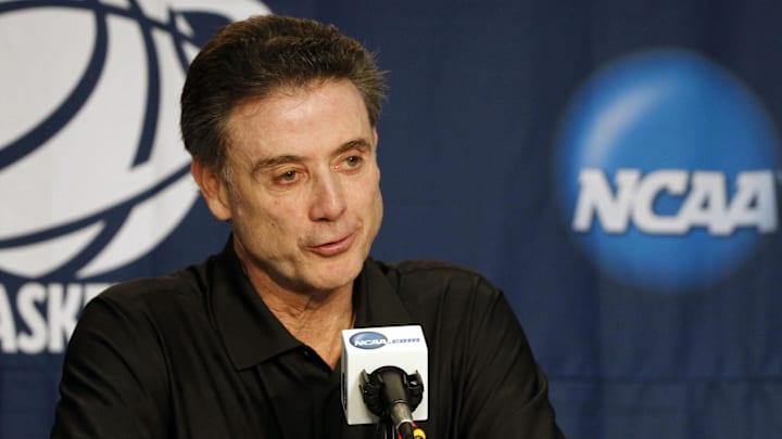 Mar 19, 2014; Orlando, FL, USA; Louisville Cardinals head coach Rick Pitino addresses the media prior to practice before the second round of the 2014 NCAA Tournament at Amway Center. Mandatory Credit: Kim Klement-Imagn Images Mar 19, 2014; Orlando, FL, USA; Louisville Cardinals head coach Rick Pitino addresses the media prior to practice before the second round of the 2014 NCAA Tournament at Amway Center. Mandatory Credit: Kim Klement-Imagn Images