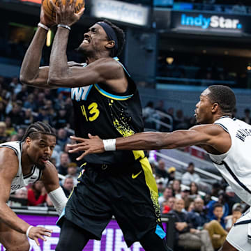 Mar 16, 2024; Indianapolis, Indiana, USA; Indiana Pacers forward Pascal Siakam (43) shoots the ball while Brooklyn Nets guard Lonnie Walker IV (8) defends in the first half at Gainbridge Fieldhouse. Mandatory Credit: Trevor Ruszkowski-Imagn Images