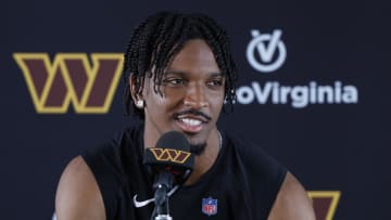 Jul 26, 2024; Ashburn, VA, USA; Washington Commanders quarterback Jayden Daniels speaks with the media after morning practice on day three of training camp at Commanders Park. Mandatory Credit: Geoff Burke-USA TODAY Sports