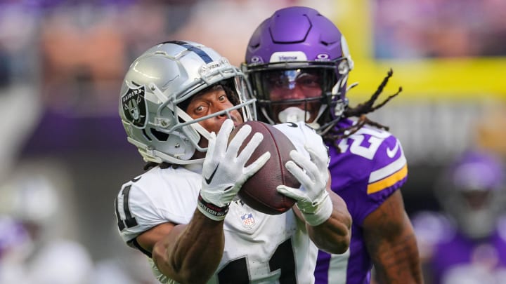 Aug 10, 2024; Minneapolis, Minnesota, USA; Las Vegas Raiders wide receiver Tre Tucker (11) catches a pass against the Minnesota Vikings in the second quarter at U.S. Bank Stadium. Mandatory Credit: Brad Rempel-USA TODAY Sports