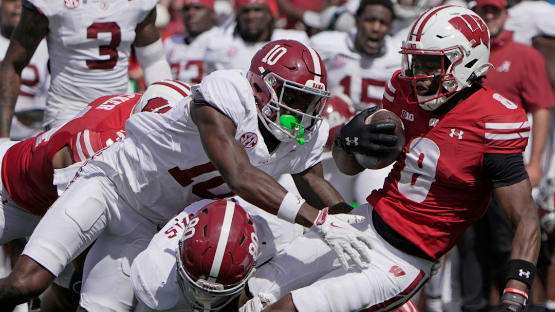 Wisconsin's Vinny Anthony II (8) is tackled by on a punt return during the third quarter of their game Saturday, September 14, 2024 at Camp Randall Stadium in Madison, Wisconsin. Alabama beat Wisconsin 42-10.
