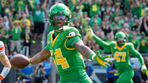 dan lanning oregon ducks northwestern wildcats oklahoma state cowboys dante moore quarterback running backs wide receiver