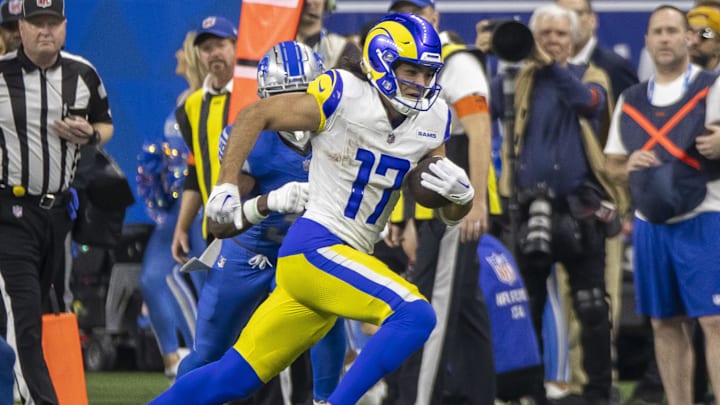 Jan 14, 2024; Detroit, Michigan, USA; Los Angeles Rams wide receiver Puka Nacua (17) runs after a catch during the second half of a 2024 NFC wild card game against the Detroit Lions at Ford Field. Mandatory Credit: David Reginek-Imagn Images