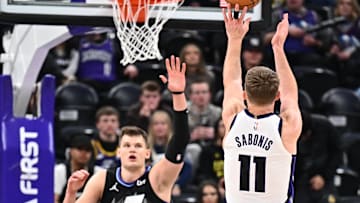 Feb 26, 2025; Salt Lake City, Utah, USA;  Sacramento Kings forward Domantas Sabonis (11) shoots over Utah Jazz center Walker Kessler (24) in the second half at Delta Center. Mandatory Credit: Jamie Sabau-Imagn Images