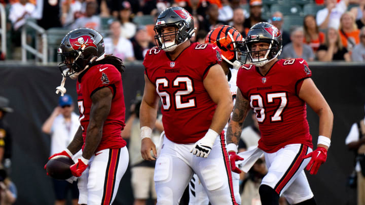 Tampa Bay Buccaneers running back Bucky Irving (7) and Tampa Bay Buccaneers center Graham Barton (62) react after he scored a touchdown in the second quarter of the NFL preseason game against the Cincinnati Bengals at Paycor Stadium in Cincinnati on Saturday, August 10, 2024.