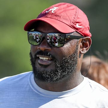 The Crimson Tide players and coaches continue working toward the season opener in practice Tuesday, Aug. 13, 2024. Alabama defensive line coach Freddie Roach works with his players.