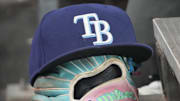 Sep 26, 2025; Toronto, Ontario, CAN; The hat and glove of Tampa Bay Rays third baseman Junior Caminero (13) in the dugout during the game against the Toronto Blue Jays at Rogers Centre. 