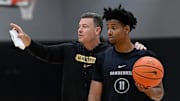 Vanderbilt head coach Mark Byington goes over a drill with guard A.J. Hoggard (11)during an NCAA college basketball practice Tuesday, October 8, 2024, in Nashville, Tenn.