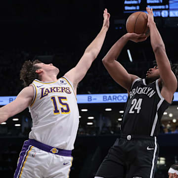 Mar 31, 2024; Brooklyn, New York, USA; Brooklyn Nets guard Cam Thomas (24) shoots the ball against Los Angeles Lakers guard Austin Reaves (15) during the first half at Barclays Center. Mandatory Credit: Vincent Carchietta-Imagn Images