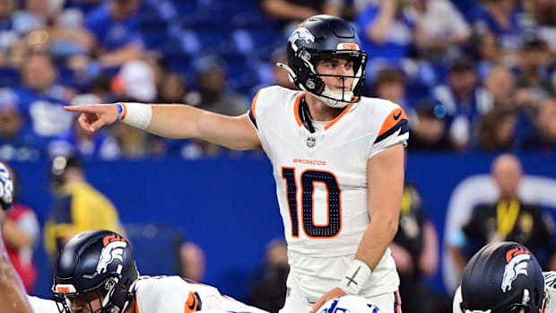 Aug 11, 2024; Indianapolis, Indiana, USA; Denver Broncos quarterback Bo Nix (10) points during the second quarter against the