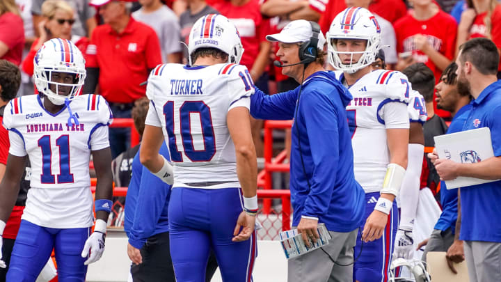 Sep 23, 2023; Lincoln, Nebraska, USA; Louisiana Tech Bulldogs head coach Sonny Cumbie talks with quarterback Jack Turner (10) during the first quarter against the Nebraska Cornhuskers at Memorial Stadium. Mandatory Credit: Dylan Widger-USA TODAY Sports