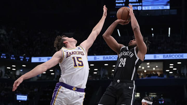 Mar 31, 2024; Brooklyn, New York, USA; Brooklyn Nets guard Cam Thomas (24) shoots the ball against Los Angeles Lakers guard Austin Reaves (15) during the first half at Barclays Center. Mandatory Credit: Vincent Carchietta-Imagn Images