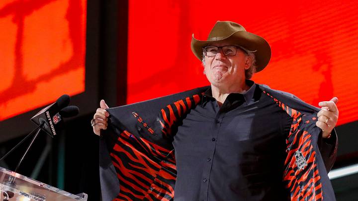 Former Cincinnati Bengals defensive lineman Tim Krumrie shows off the tiger-striped lining of his suit before announcing the team’s selection with the 49th overall pick during the second round of the 2025 NFL Draft on Friday, April 25, 2025, at Lambeau Field in Green Bay, Wisconsin. The draft runs through April 26.
Tork Mason/USA TODAY NETWORK-Wisconsin
