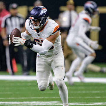 Oct 17, 2024; New Orleans, Louisiana, USA; Denver Broncos linebacker Cody Barton (55) runs back an interception for a touchdown against New Orleans Saints quarterback Spencer Rattler during the fourth quarter at Caesars Superdome. Mandatory Credit: Matthew Hinton-Imagn Images