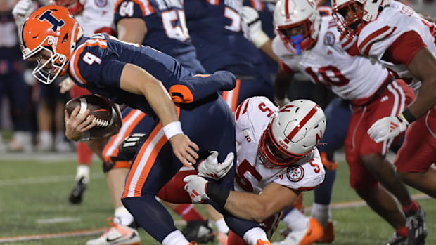 Illinois Fighting Illini quarterback Luke Altmyer (9) is tackled by Nebraska Cornhuskers linebacker 