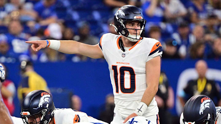 Aug 11, 2024; Indianapolis, Indiana, USA; Denver Broncos quarterback Bo Nix (10) points during the second quarter against the Indianapolis Colts at Lucas Oil Stadium. Mandatory Credit: Marc Lebryk-Imagn Images