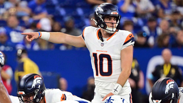 Aug 11, 2024; Indianapolis, Indiana, USA; Denver Broncos quarterback Bo Nix (10) points during the second quarter against the Indianapolis Colts at Lucas Oil Stadium. Mandatory Credit: Marc Lebryk-USA TODAY Sports