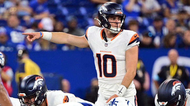 Aug 11, 2024; Indianapolis, Indiana, USA; Denver Broncos quarterback Bo Nix (10) points during the second quarter against the Indianapolis Colts at Lucas Oil Stadium. 