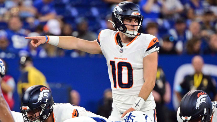 Aug 11, 2024; Indianapolis, Indiana, USA; Denver Broncos quarterback Bo Nix (10) points during the second quarter against the Indianapolis Colts at Lucas Oil Stadium. 