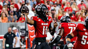 Sep 27, 2025; Raleigh, North Carolina, USA; North Carolina State Wolfpack quarterback CJ Bailey (11) with the ball during the first half of the game against Virginia Tech Hokies at Carter-Finley Stadium. Mandatory Credit: Jaylynn Nash-Imagn Images