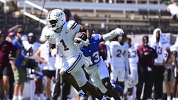 Sep 21, 2024; Starkville, Mississippi, USA; Mississippi State Bulldogs wide receiver Kelly Akharaiyi (1) runs the ball against the Florida Gators during the fourth quarter
