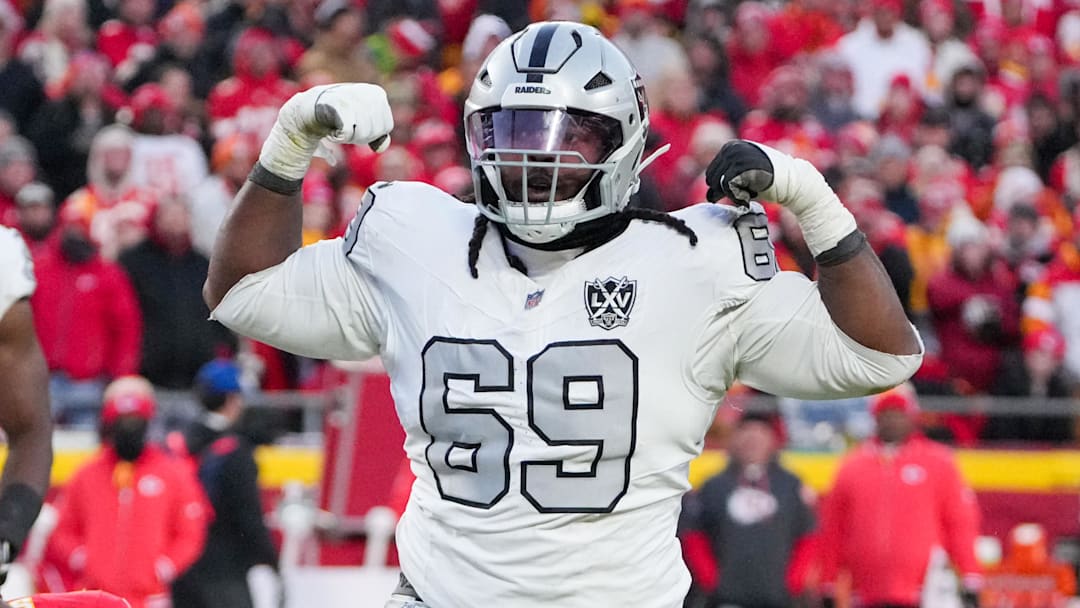 Nov 29, 2024; Kansas City, Missouri, USA; Las Vegas Raiders defensive tackle Adam Butler (69) celebrates after making a sack against the Kansas City Chiefs during the second half at GEHA Field at Arrowhead Stadium. Mandatory Credit: Denny Medley-Imagn Images