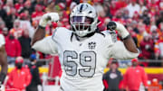 Nov 29, 2024; Kansas City, Missouri, USA; Las Vegas Raiders defensive tackle Adam Butler (69) celebrates after making a sack against the Kansas City Chiefs during the second half at GEHA Field at Arrowhead Stadium. Mandatory Credit: Denny Medley-Imagn Images