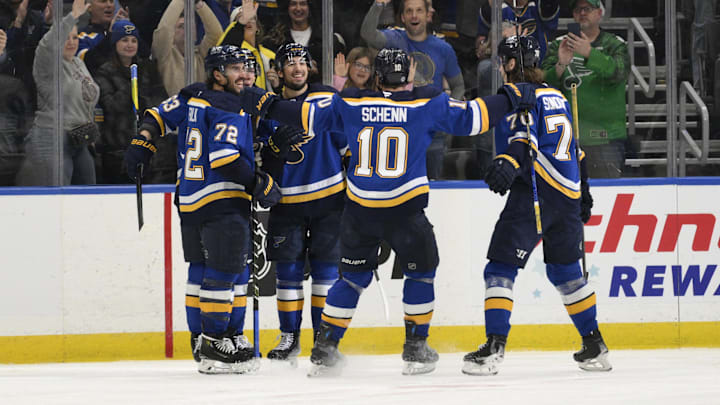 Apr 15, 2025; St. Louis, Missouri, USA; St. Louis Blues right wing Jordan Kyrou (25) is congratulated by teammates after scoring a goal against the Utah Hockey Club during the third period at Enterprise Center. Mandatory Credit: Jeff Le-Imagn Images