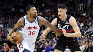 Mar 13, 2025; Detroit, Michigan, USA;  Washington Wizards guard Marcus Smart (36) dribbles defended by Detroit Pistons forward Simone Fontecchio (19) in the first half at Little Caesars Arena. Mandatory Credit: Rick Osentoski-Imagn Images