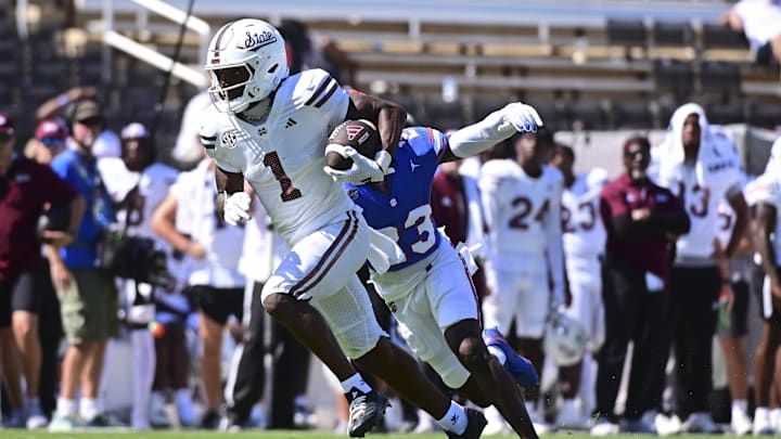 Sep 21, 2024; Starkville, Mississippi, USA; Mississippi State Bulldogs wide receiver Kelly Akharaiyi (1) runs the ball against the Florida Gators during the fourth quarter at Davis Wade Stadium at Scott Field. Mandatory Credit: Matt Bush-Imagn Images