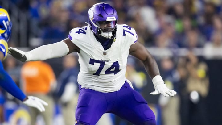 Jan 13, 2025; Glendale, AZ, USA; Minnesota Vikings tackle Cam Robinson (74) against the Los Angeles Rams during an NFC wild card game at State Farm Stadium. Mandatory Credit: Mark J. Rebilas-Imagn Images