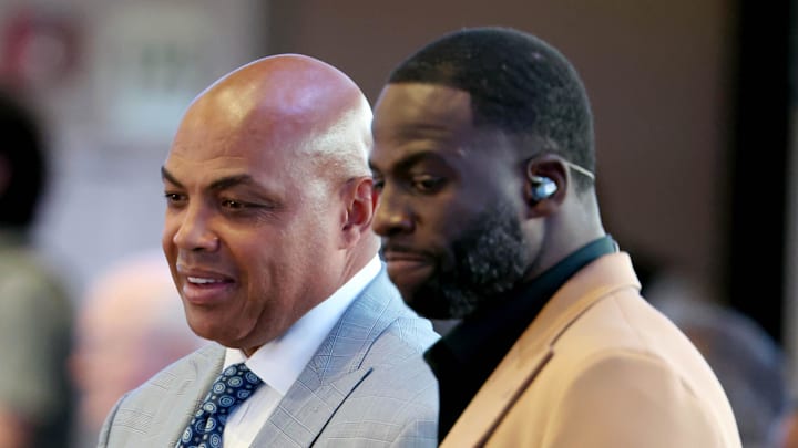 May 26, 2024; Dallas, Texas, USA; Charles Barkley (left) and Draymond Green (right) look on in the first half between the Dallas Mavericks and the Minnesota Timberwolves during game three of the western conference finals for the 2024 NBA playoffs at American Airlines Center. 