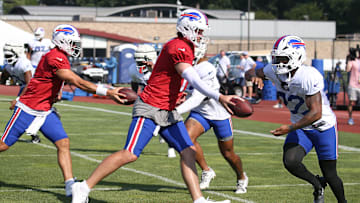 Bills quarterback Josh Allen hands off to running back Ray Davis during position drills during day five of Buffalo Bills training camp at St. John Fisher University Monday, July 28, 2025 in Pittsford, NY.