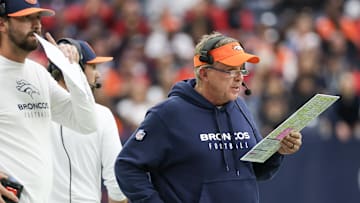 Dec 3, 2023; Houston, Texas, USA; Denver Broncos head coach Sean Payton looks at his play card while
