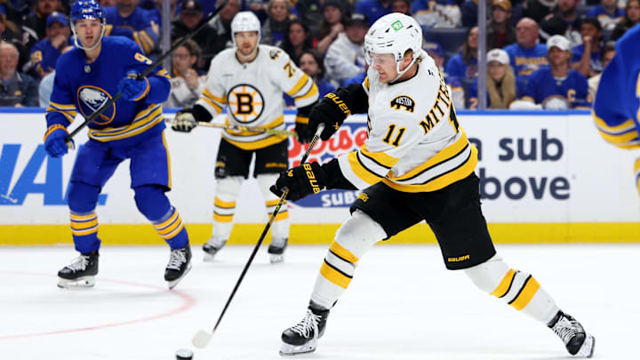Apr 21, 2026; Buffalo, New York, USA; Boston Bruins center Casey Mittelstadt (11) takes a shot on goal during the third period against the Buffalo Sabres in game two of the first round of the 2026 Stanley Cup Playoffs at KeyBank Center. Mandatory Credit: Timothy T. Ludwig-Imagn Images