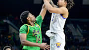 Feb 22, 2025; South Bend, Indiana, USA; Pittsburgh Panthers forward Cameron Corhen (2) goes up for a shot as Notre Dame Fighting Irish forward Kebba Njie (14) defends in the second half at the Purcell Pavilion. Mandatory Credit: Matt Cashore-Imagn Images